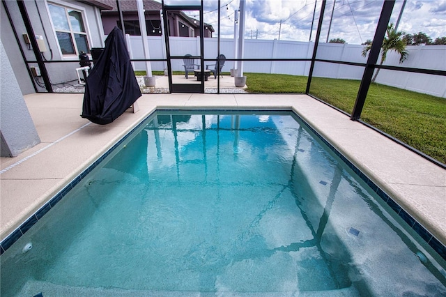 view of swimming pool with a lawn and a patio