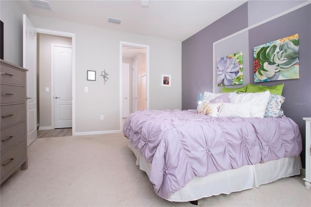 bedroom featuring light colored carpet