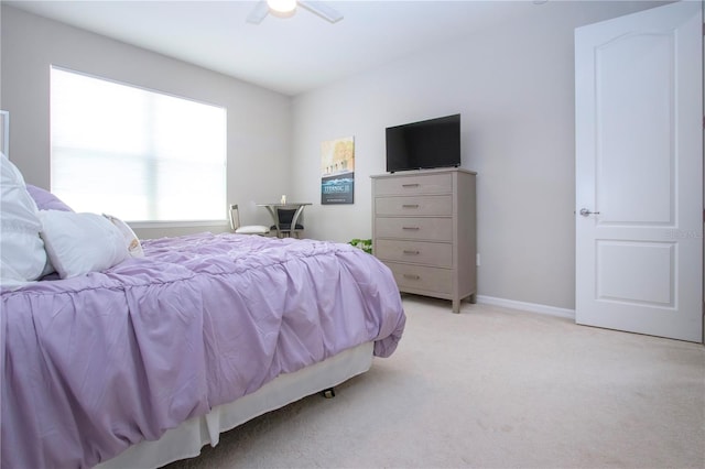 bedroom with light colored carpet and ceiling fan