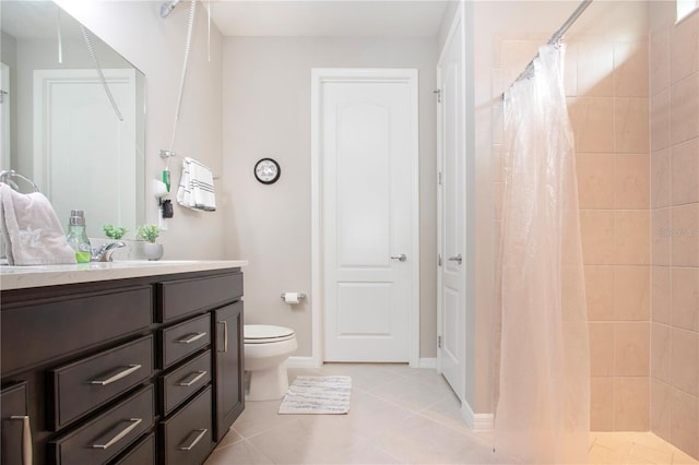 bathroom featuring tile patterned floors, a shower with curtain, toilet, and vanity