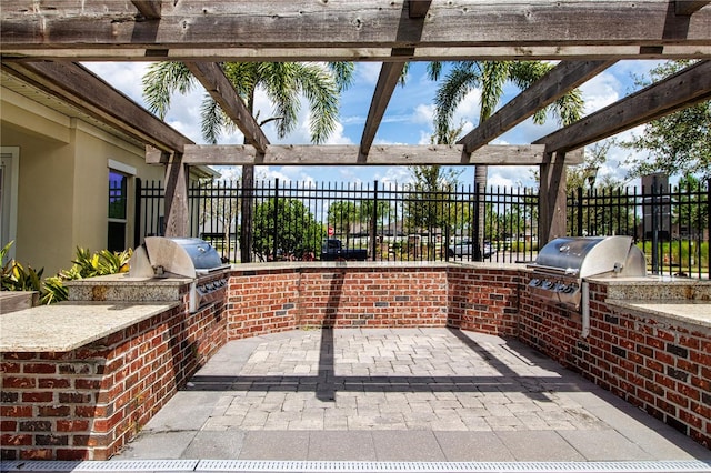 view of patio / terrace featuring area for grilling, grilling area, and a pergola