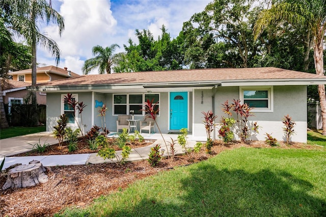 single story home with a front yard