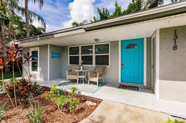 entrance to property with a porch