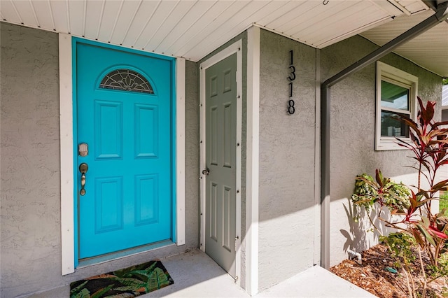 property entrance featuring covered porch