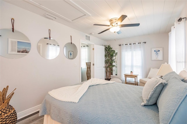 bedroom with ceiling fan and hardwood / wood-style floors