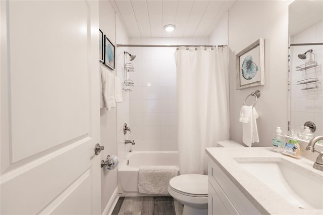 full bathroom with vanity, toilet, hardwood / wood-style floors, and shower / bath combo