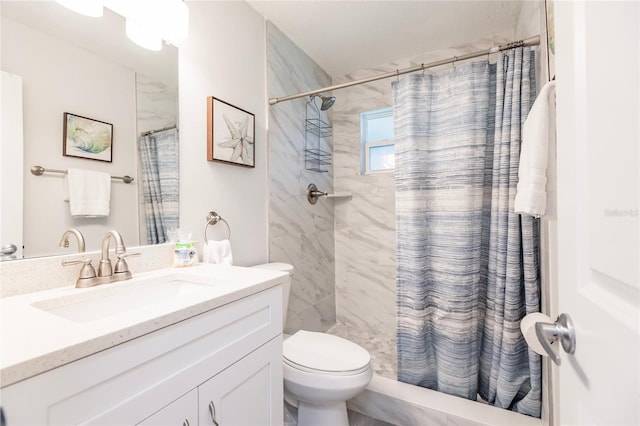 bathroom featuring vanity, toilet, and a shower with shower curtain