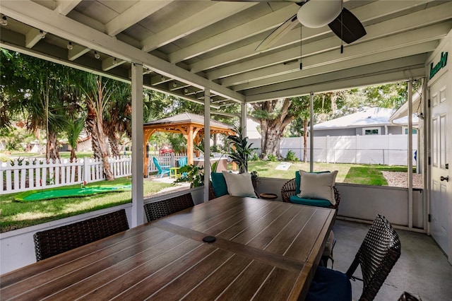 exterior space with ceiling fan