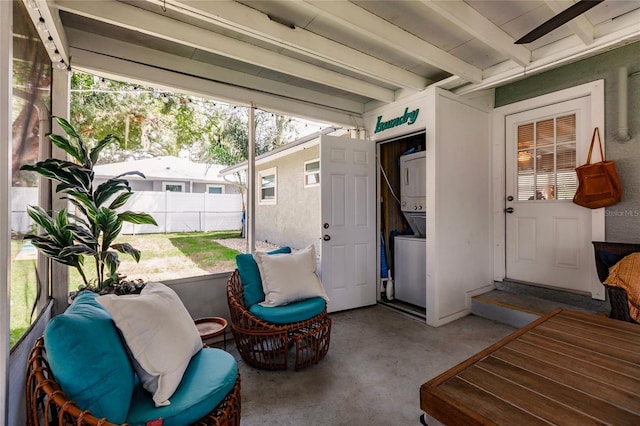 exterior space with stacked washing maching and dryer