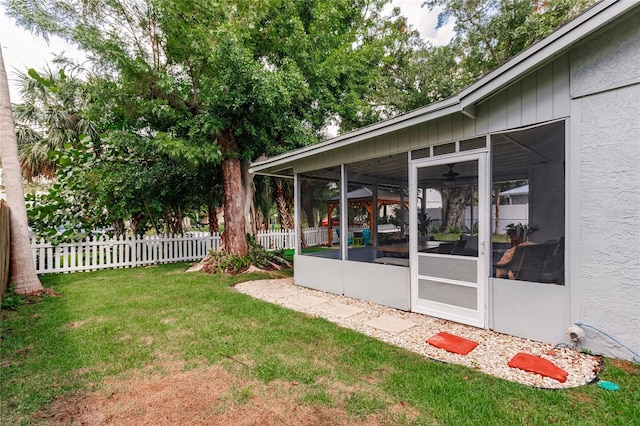 view of yard with a sunroom