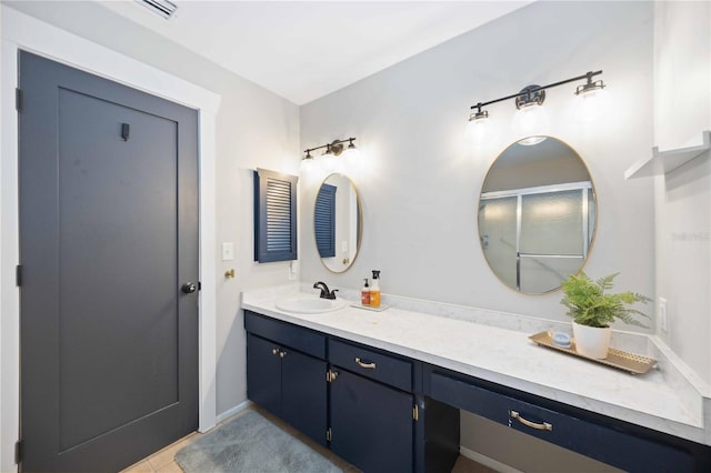 bathroom featuring tile patterned flooring and vanity