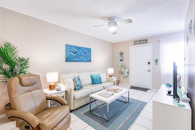 tiled living room with ceiling fan