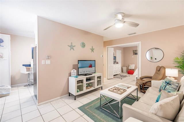 living room with ceiling fan and light tile patterned floors