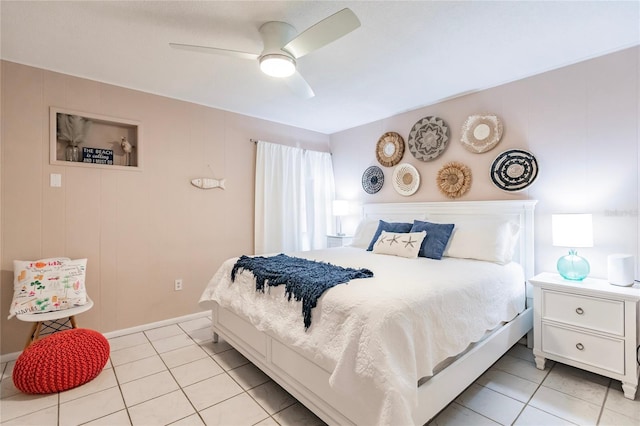 tiled bedroom featuring ceiling fan