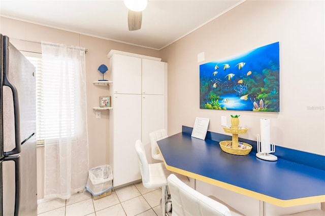 dining space featuring light tile patterned flooring and ceiling fan