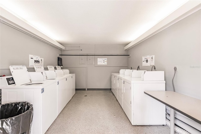 clothes washing area with separate washer and dryer