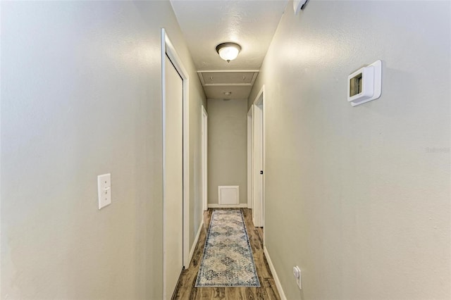 hallway featuring wood-type flooring