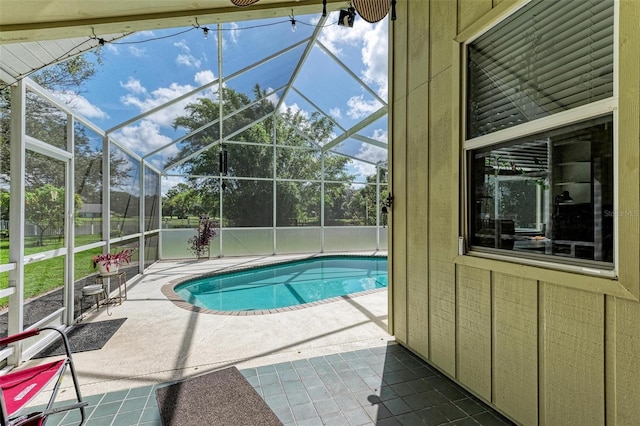 view of pool featuring a patio and a lanai