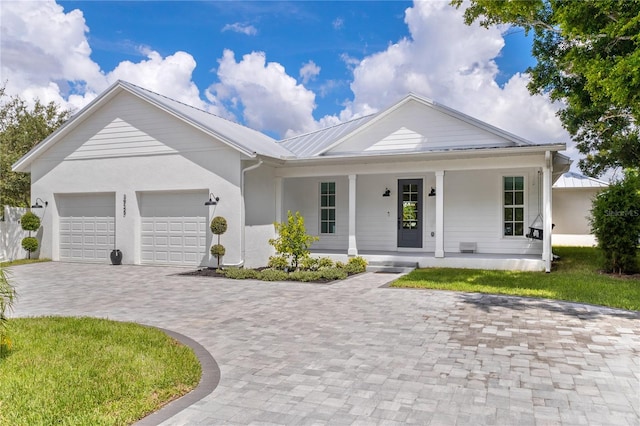 view of front of home with a garage and covered porch