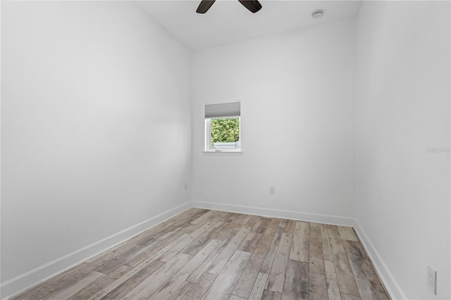 empty room featuring ceiling fan and light wood-type flooring