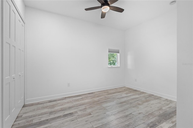 empty room featuring light hardwood / wood-style flooring and ceiling fan