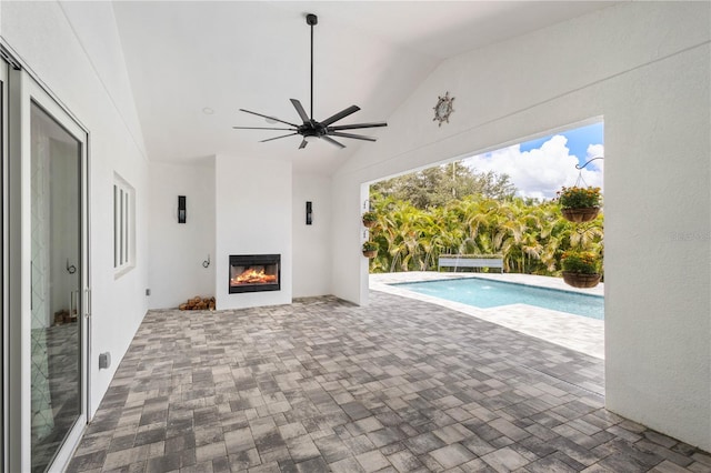 view of swimming pool with a patio area and ceiling fan