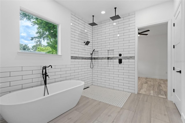 bathroom featuring plus walk in shower and ceiling fan