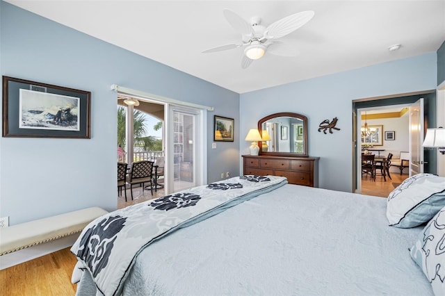 bedroom with access to exterior, ceiling fan, and hardwood / wood-style flooring