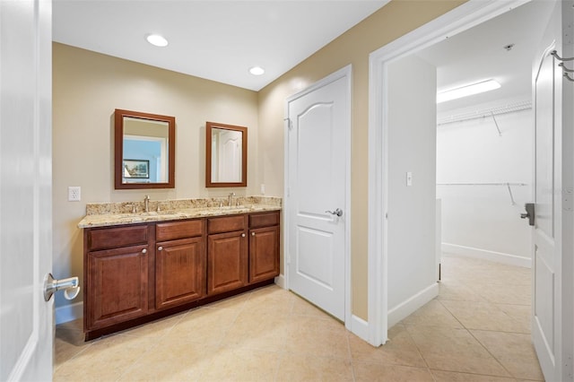 bathroom with vanity and tile patterned flooring