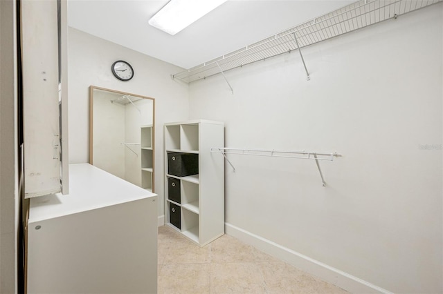 walk in closet featuring light tile patterned floors