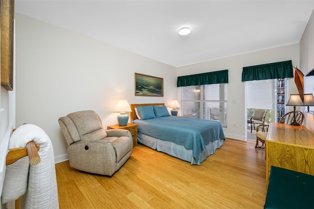 bedroom with light hardwood / wood-style floors