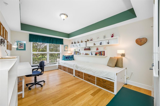 bedroom with light hardwood / wood-style floors