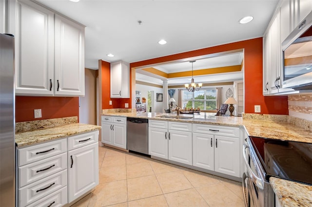 kitchen with hanging light fixtures, a notable chandelier, appliances with stainless steel finishes, and white cabinets