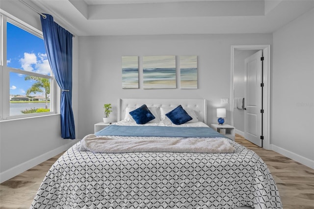 bedroom featuring wood-type flooring