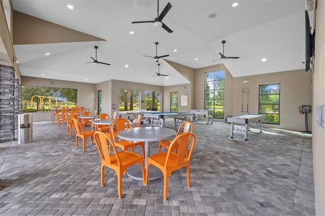 dining space with high vaulted ceiling, ceiling fan, and billiards