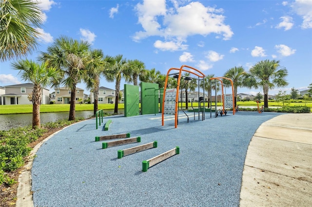 view of jungle gym featuring a water view