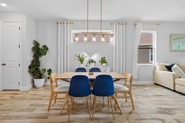 dining space with light wood-type flooring