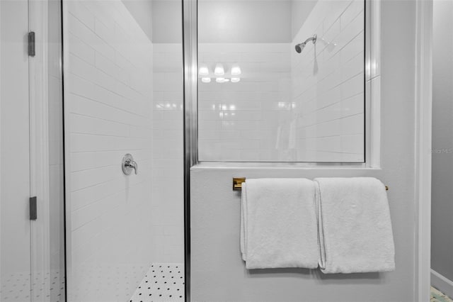 bathroom with a shower with shower door