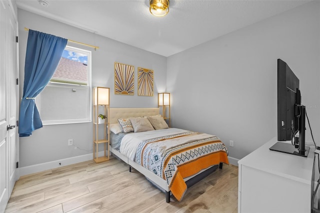 bedroom featuring light wood-type flooring