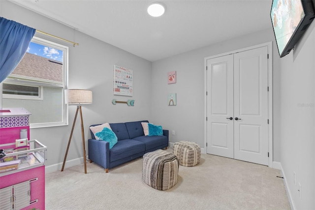 sitting room with light colored carpet