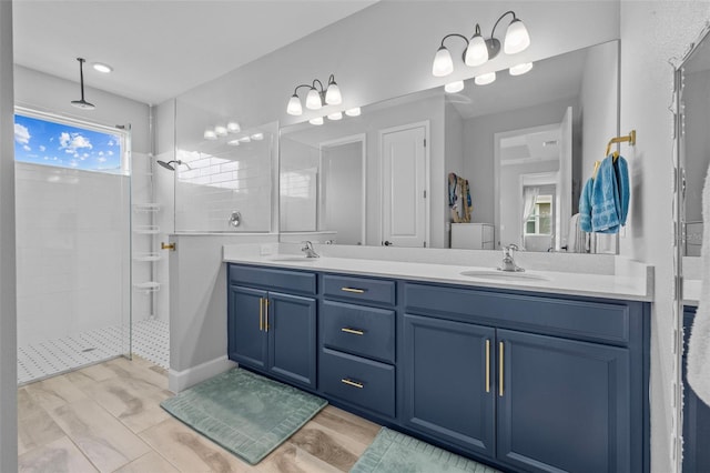 bathroom featuring vanity and a tile shower