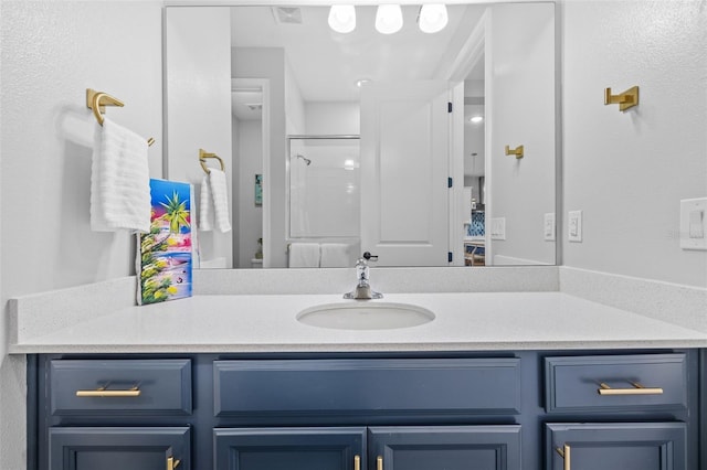 bathroom featuring vanity and walk in shower