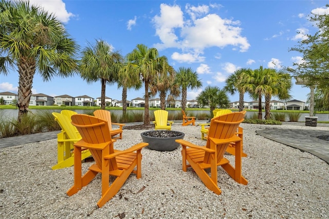 view of playground with a patio area and an outdoor fire pit