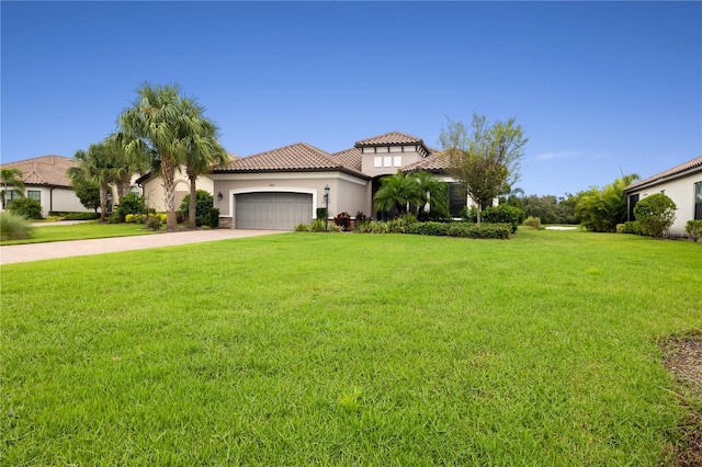 mediterranean / spanish-style home featuring a garage and a front lawn