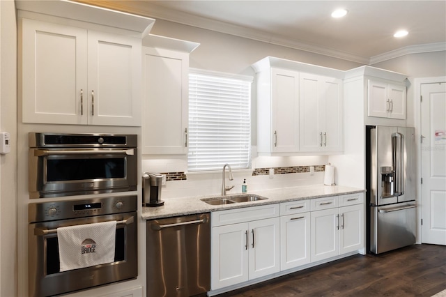 kitchen with white cabinetry, dark hardwood / wood-style flooring, stainless steel appliances, and sink