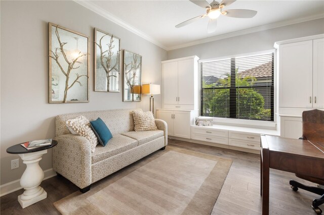 living room featuring ceiling fan, light hardwood / wood-style floors, and ornamental molding