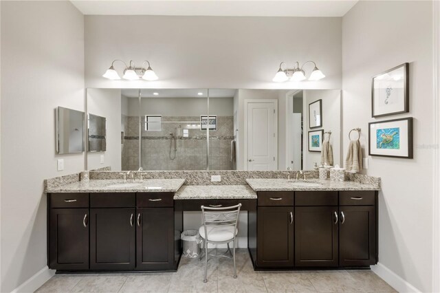 bathroom with vanity, an enclosed shower, and tile patterned flooring