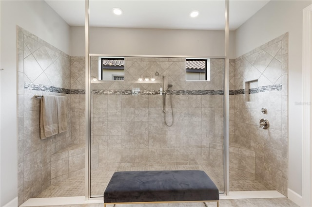 bathroom with tiled shower