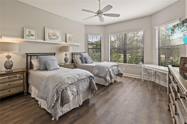 bedroom with ceiling fan and dark hardwood / wood-style floors