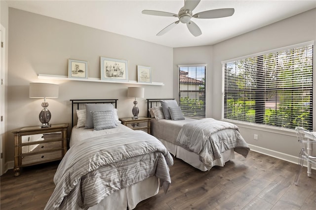 bedroom with ceiling fan and dark hardwood / wood-style flooring